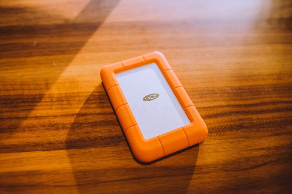 Orange Phone Case on Wooden Surface